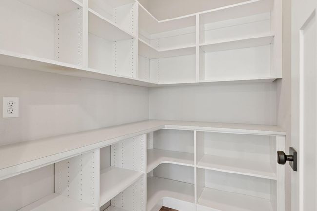 Incredible walk-in pantry holds it all! | Image 16