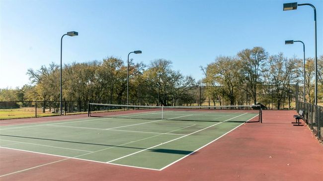 View of tennis court with community basketball court | Image 13