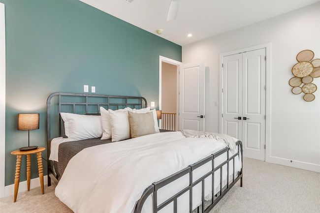 Bedroom with a ceiling fan, a closet, baseboards, light carpet, and recessed lighting | Image 18
