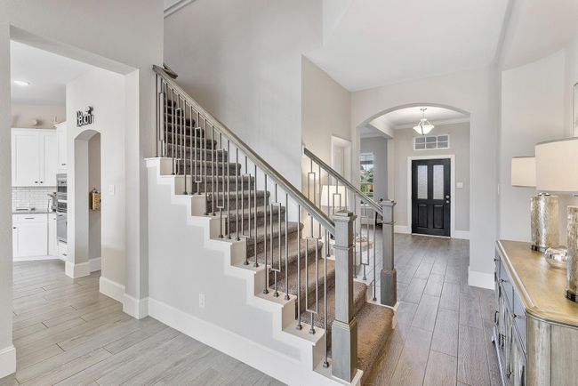 Join me upstairs to discover a huge game room—just one of the many amazing spaces this home has to offer! | Image 30