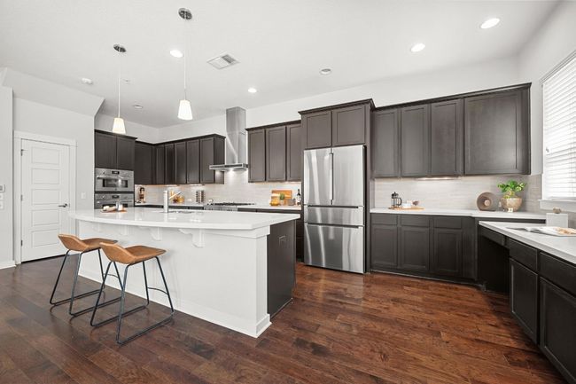 The built-in desk area is perfect for jotting down recipes, making grocery lists, or checking emails, all without stepping out of the kitchen | Image 14