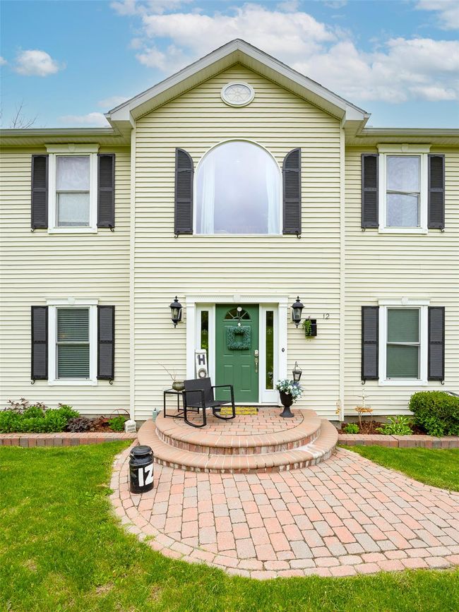 Rear view of property featuring a lawn | Image 32