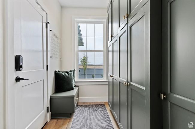 Doorway to outside with light wood-type flooring and baseboards | Image 15