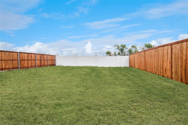 View of fenced backyard | Image 9
