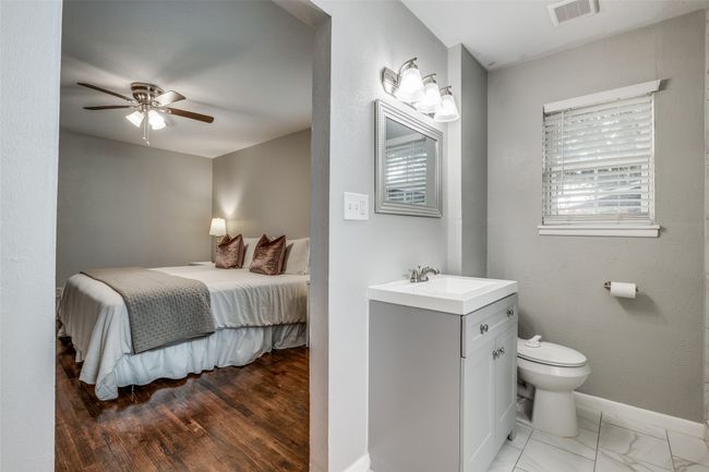 Bedroom featuring baseboards and ceiling fan | Image 31