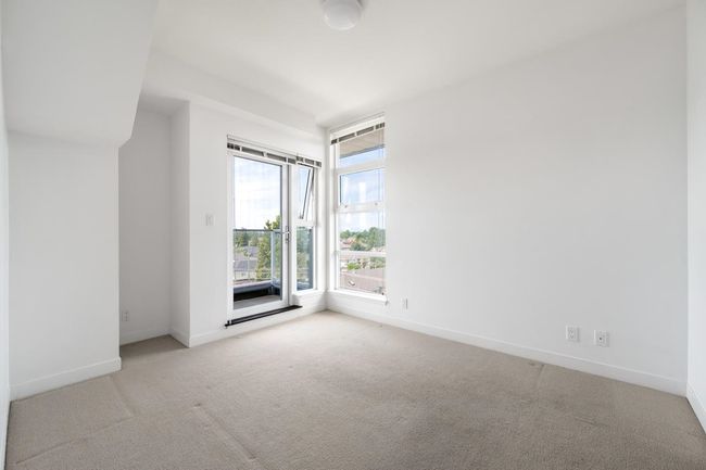 Empty room featuring carpet and baseboards | Image 6