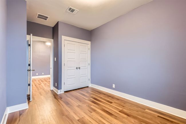 Unfurnished bedroom featuring light wood-type flooring and a closet | Image 18