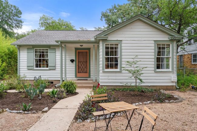 Beautiful front of house with landscaped front yard and tall trees | Image 19