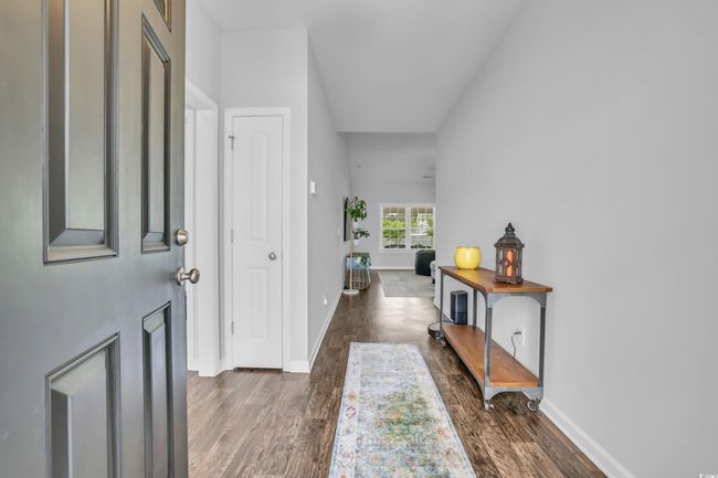 Foyer featuring baseboards and dark wood-style floors | Image 7