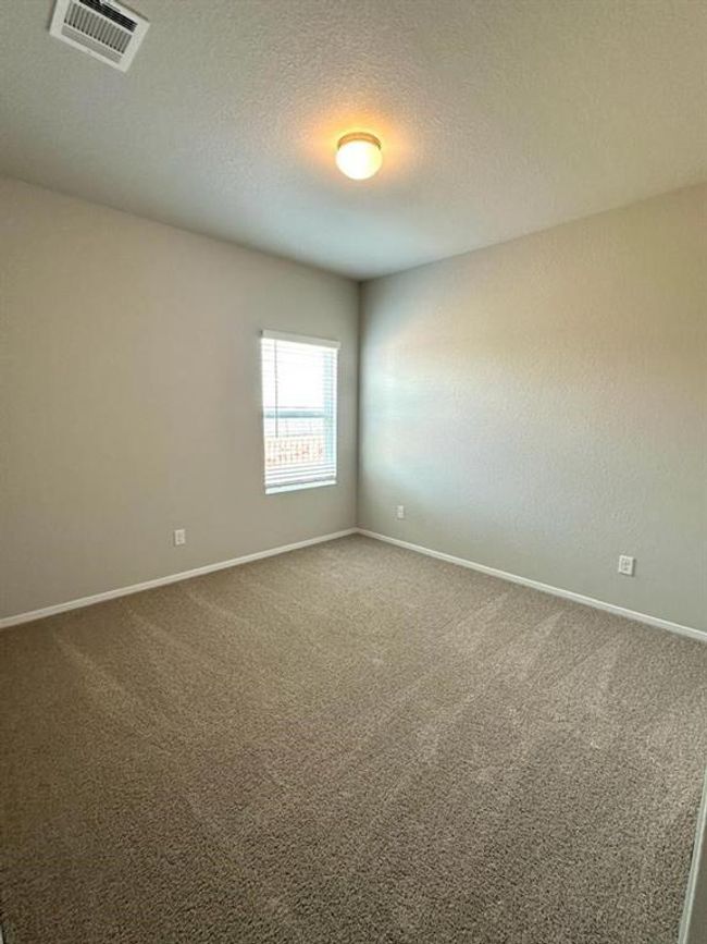 Empty room featuring carpet floors, baseboards, and a textured ceiling | Image 14