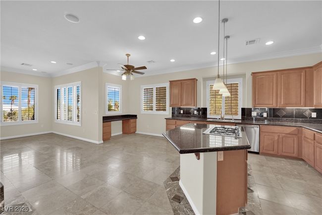 Kitchen and built in desk area in the background | Image 13