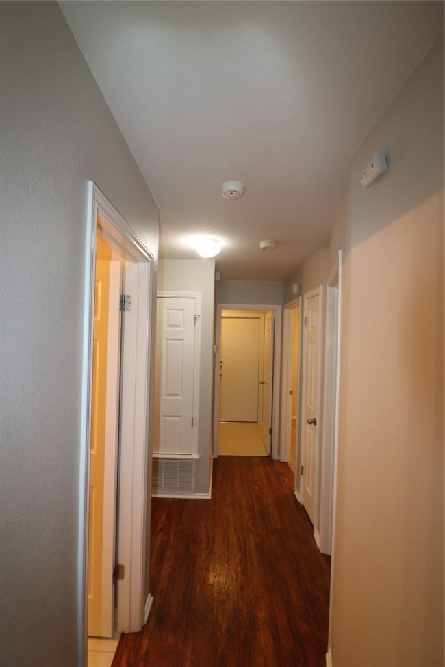 Hall featuring wood finished floors | Image 18