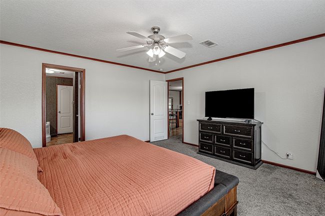 Main house- primary Bedroom located off the main living area | Image 12