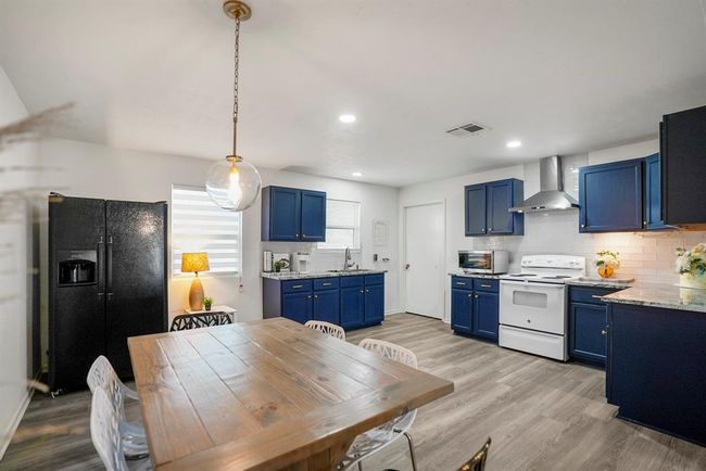 Modern appliances and a spacious layout make the kitchen both functional and inviting—ready for everyday meals or casual entertaining. | Image 11