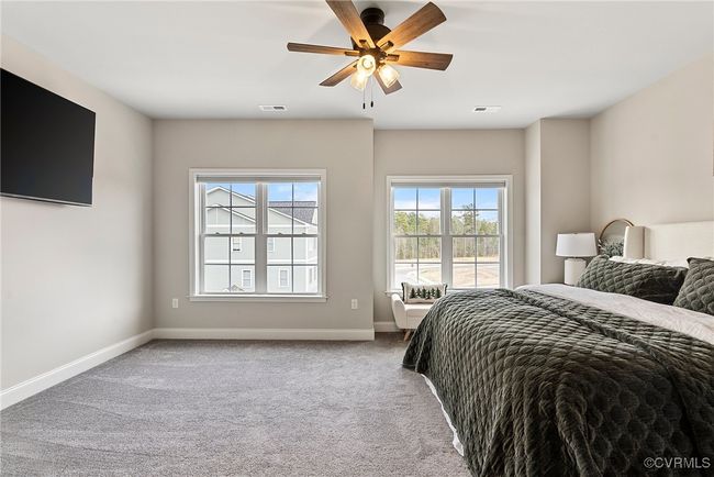 Carpeted bedroom featuring ceiling fan | Image 16