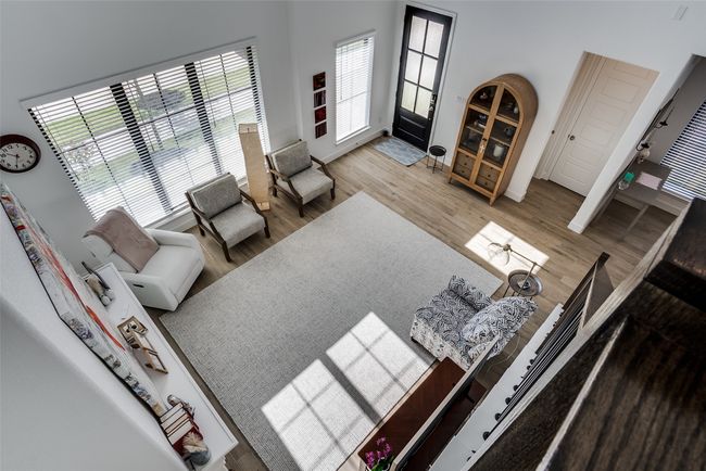 Living area featuring wood finished floors and baseboards | Image 6