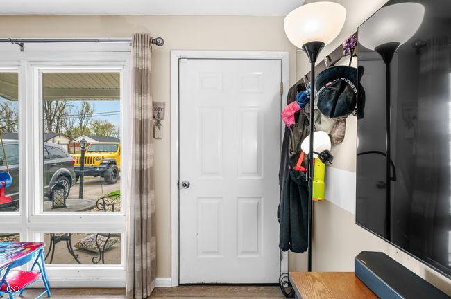 doorway featuring wood finished floors | Image 12