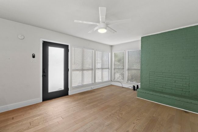 Unfurnished room featuring a ceiling fan, light wood-type flooring, and baseboards | Image 8