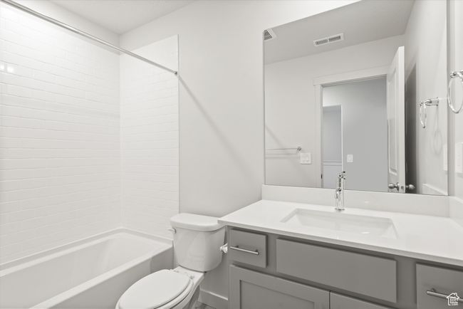 Bathroom featuring vanity and shower combination | Image 43