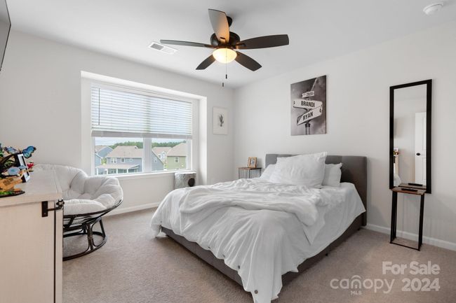 Bedroom #4 has lots of natural light, ceiling fan, soft carpeting. Room for family or guests. Nice sized closet! | Image 27