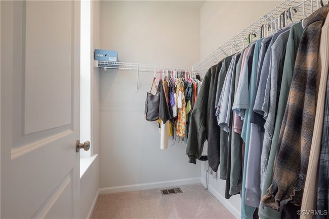 Spacious closet featuring visible vents and carpet | Image 35