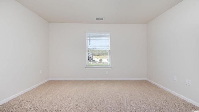 Carpeted spare room featuring baseboards | Image 25