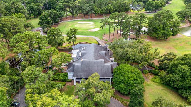 Aerial view of a local golf course and a tree filled landscape | Image 40