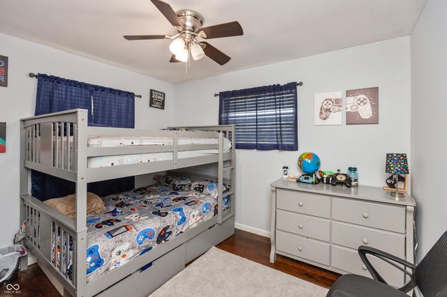 bedroom featuring wood finished floors and ceiling fan | Image 16