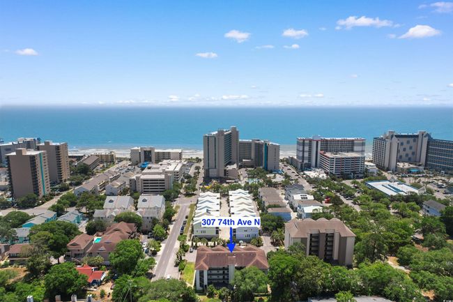 View of urban area featuring a nearby body of water | Image 31
