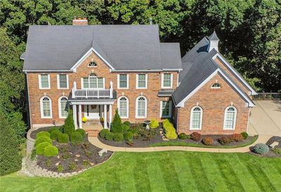 Colonial home with a front yard and a balcony | Image 2