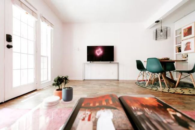 Living room with wood finished floors and baseboards | Image 6