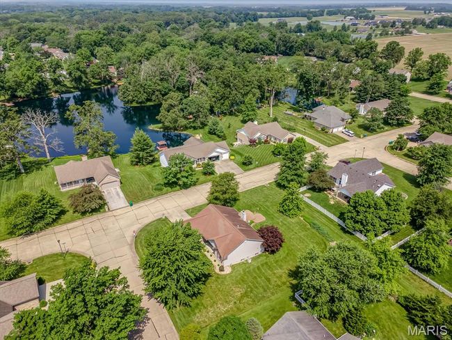 Aerial view of residential area featuring a nearby body of water | Image 34