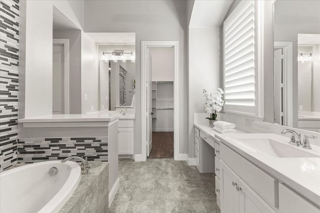 Full bath with dual vanity, garden tub, tiled flooring | Image 24