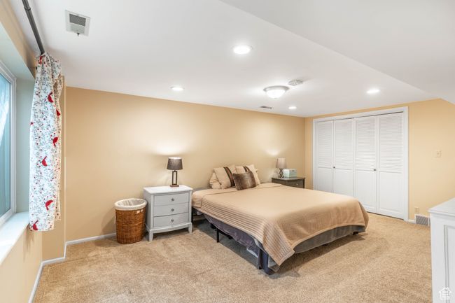 Carpeted bedroom with baseboards, visible vents, and recessed lighting | Image 15