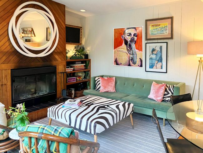 Living room with a large fireplace and carpet flooring | Image 4