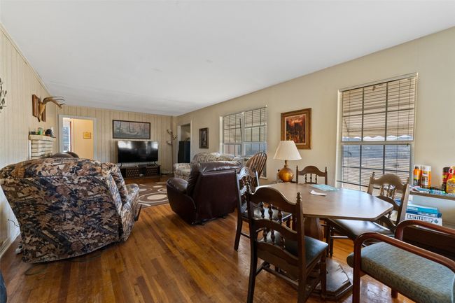 Dining room with wood-type flooring | Image 7