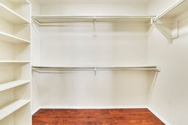 Spacious closet with hardwood / wood-style flooring | Image 35