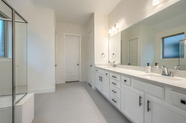 Full bathroom featuring double vanity, baseboards, and tile patterned floors | Image 20