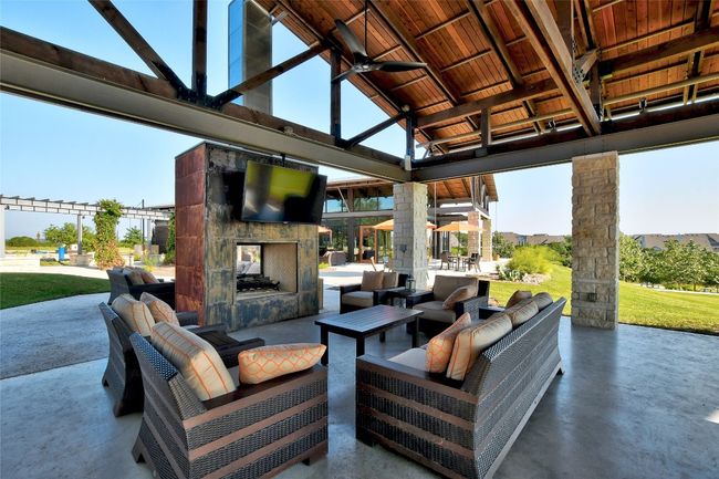 View of patio / terrace with an outdoor living space with a fireplace and a gazebo | Image 37