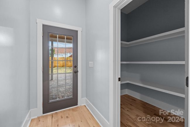 Back door down hall from kitchen, pantry on right | Image 20