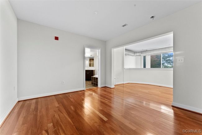 Unfurnished room with baseboards and wood finished floors | Image 32