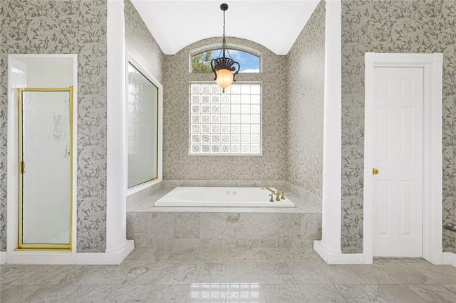 Indulge in relaxation with a luxurious oversized jetted tub. | Image 31