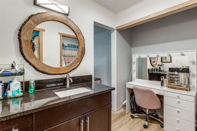 Office area with light wood-style flooring and a sink | Image 18