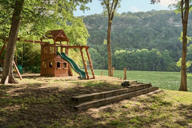 View of playground with a view of trees and a yard | Image 22