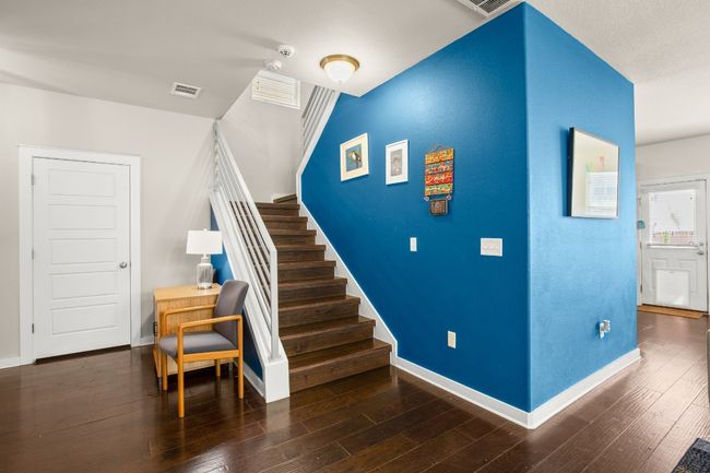 Step inside to find an open-concept floorplan with neutral tones and stunning hardwood floors that create a warm, welcoming atmosphere. | Image 6
