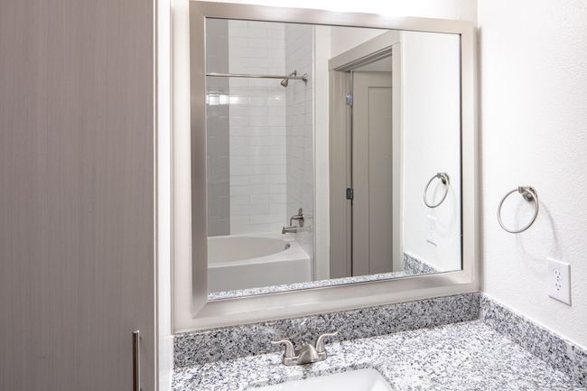Bathroom with tiled shower / bath combo and vanity | Image 7