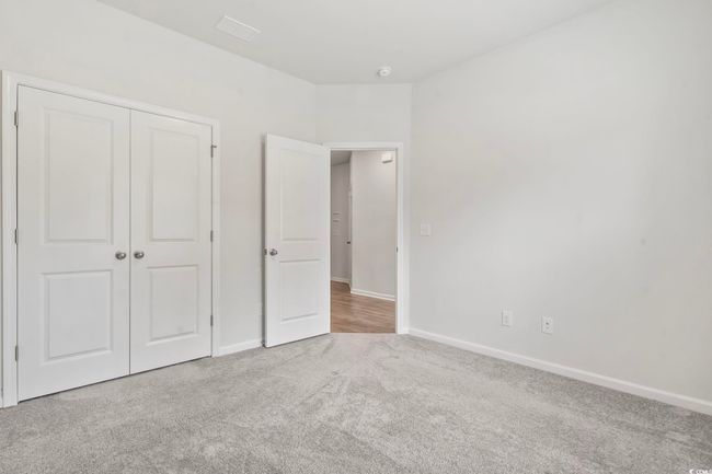 Unfurnished bedroom with carpet floors and a closet | Image 36