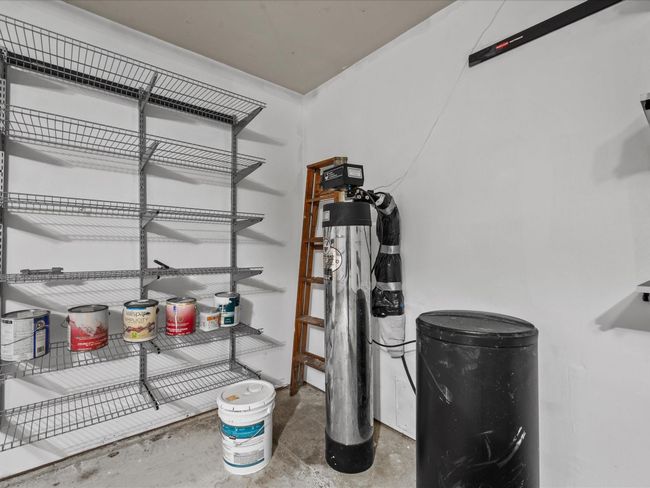 Garage with shelves and whole-home water purification | Image 38
