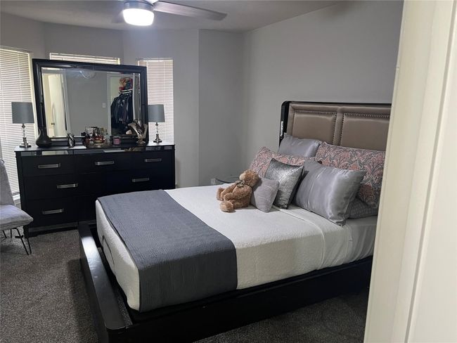 Bedroom featuring carpet and ceiling fan | Image 4