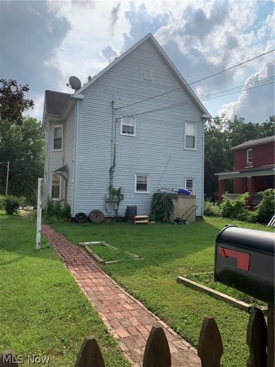 View of property exterior featuring a yard | Image 2